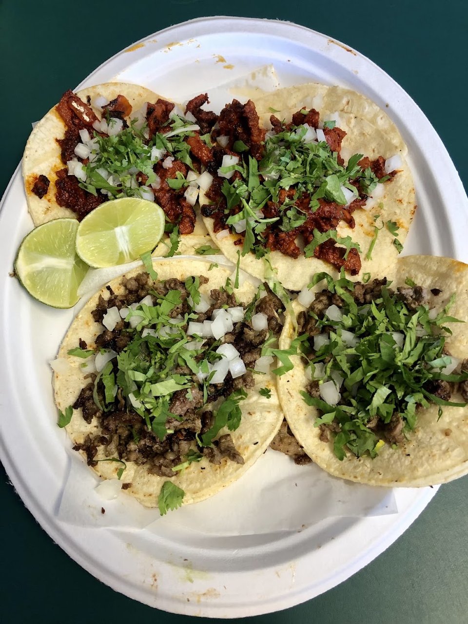 Colorful taco plates on a restaurant table.